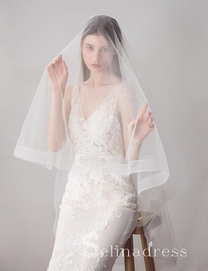 http://www.selinadress.com/cdn/shop/products/two-layers-ivory-tulle-knee-length-wedding-veils-alc011-2_1200x1200.jpg?v=1572163351